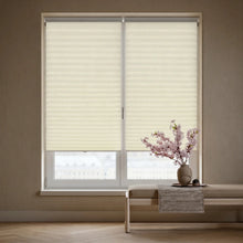 Load image into Gallery viewer, Elegant Creamy White (Ivory Beige) 3 8 Inch Budget Single Cell Light Filtering Cordless Shades complementing a modern living space, gently filtering daylight to create a warm glow.
