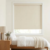 Classic Fabric Blackout Roller Shades in creamy white create a peaceful atmosphere for restful sleep in this serene bedroom with beige accents and natural light.