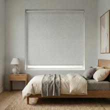 Load image into Gallery viewer, Modern Fabric Blackout Roller Shades in Creamy White provide sleek, light-blocking solutions for bedrooms with a clean and minimalistic aesthetic.
