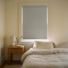 Load image into Gallery viewer, Upgrade your minimalist bedroom with Creamy White (Misty Gray) 9 16 Inch Classic Single Cell Blackout Cordless Shades, perfect for dimming the room completely.

