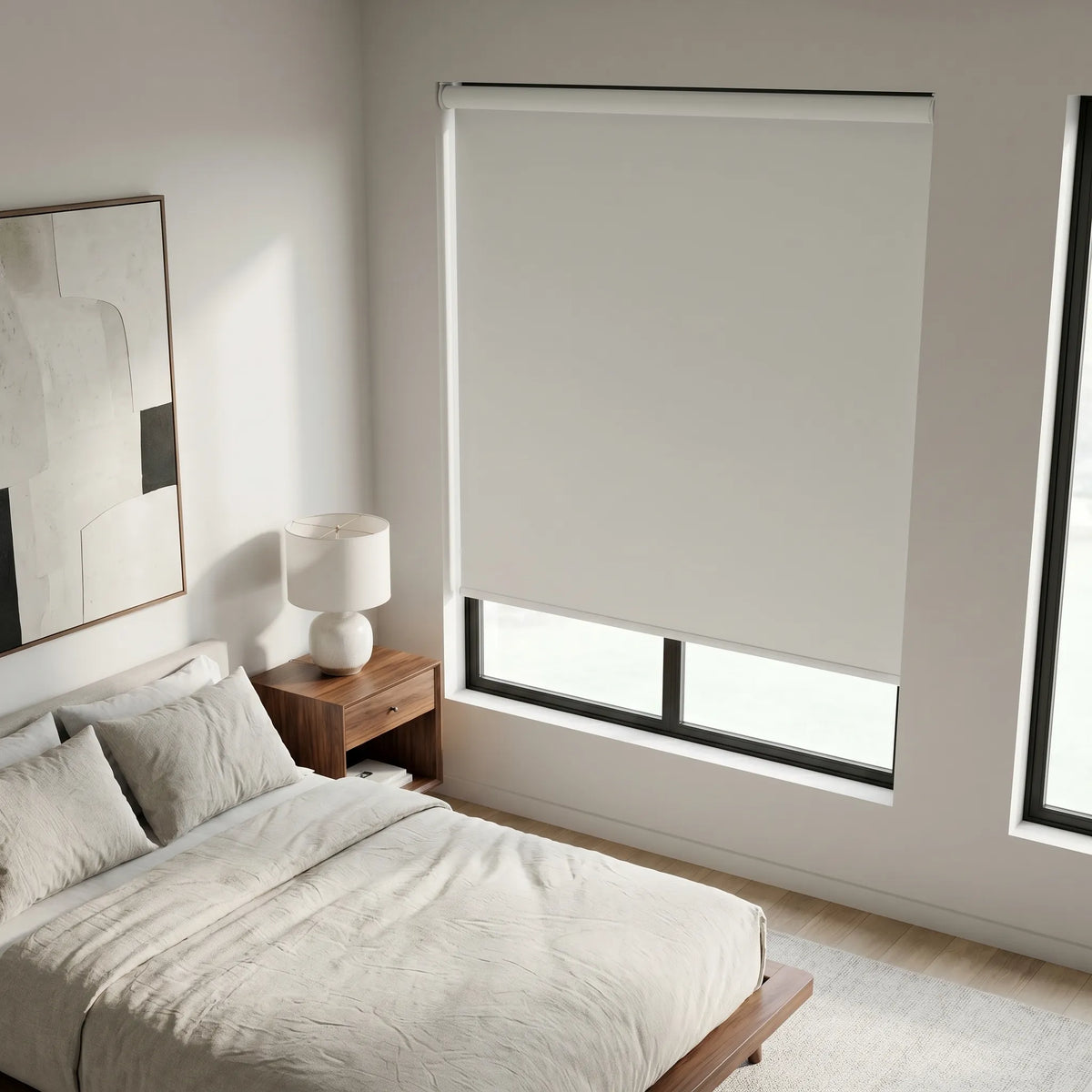 Modern Fabric Blackout Roller Shades add a touch of creamy elegance to this serene bedroom retreat, blocking out unwanted light and promoting peaceful rest.