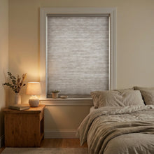 Load image into Gallery viewer, This modern bedroom is enhanced by Creamy White (Pewter) 3 8 Inch Budget Double Cell Light Filtering Cordless Shades, casting a serene, filtered light across the room.
