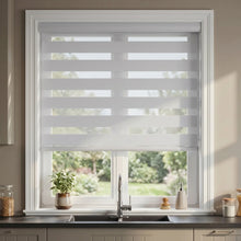 Load image into Gallery viewer, Elevate your kitchen with Zebra Room Darkening Roller Shades, perfect for modern spaces like this light beige haven.
