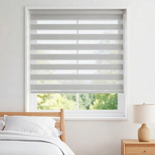 Load image into Gallery viewer, Brighten up your bedroom with Zebra Solar Roller Shades in creamy white, blocking harsh UV rays and filtering natural light.
