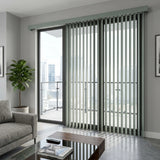 View of a serene living space with Crisp White 3 1/2 Inch Signature Pvc Vertical Blinds, perfect for covering sliding glass doors or large windows.