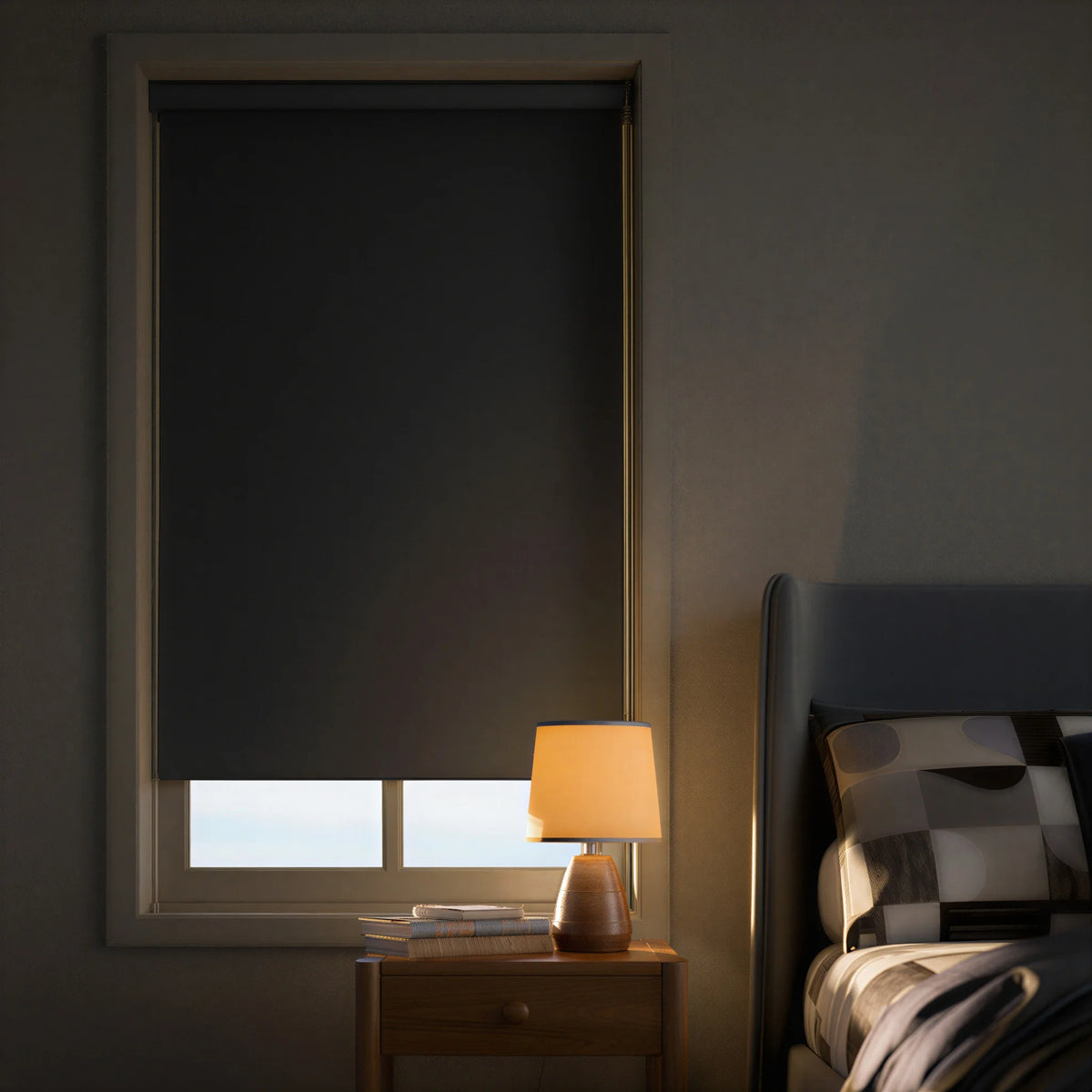 Nighttime view of dark grey Raw Umber blackout roller shades, showing complete privacy and light control.