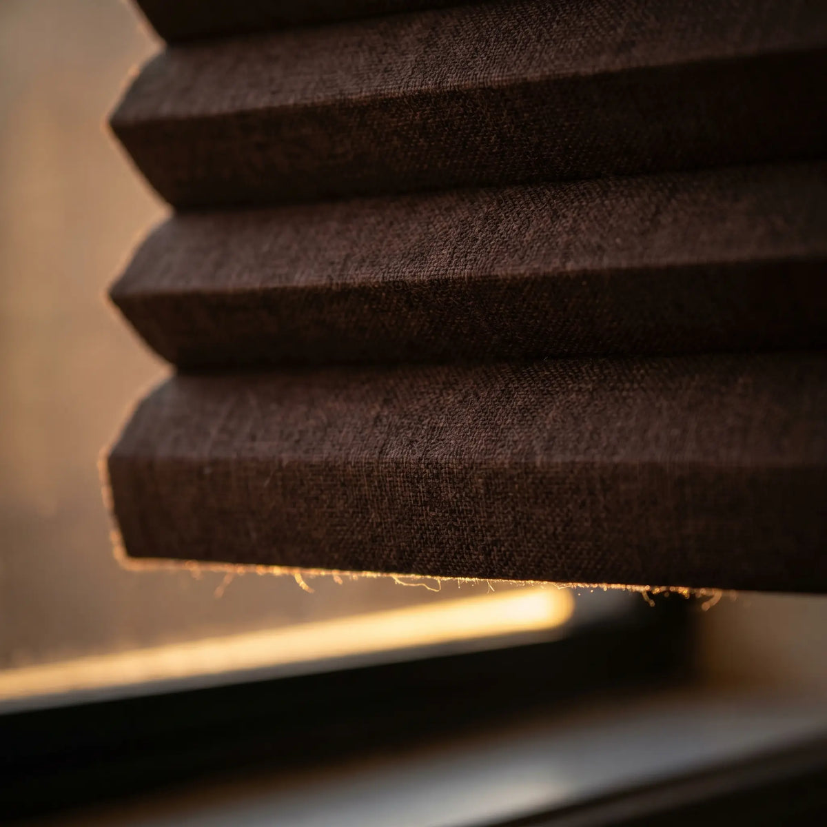 Beautiful Earthy Brown (Sticks & Stones) 9 16 Inch Classic Single Cell Blackout Cordless Shades providing a stylish touch to this warm living space, providing complete light blockage and privacy.