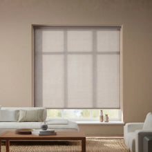 Load image into Gallery viewer, A stylish installation of Flagstone Grey Luxe natural light filtering roller shades, enhancing a modern interior space.
