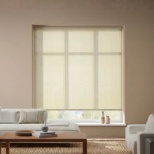 Load image into Gallery viewer, A stylish installation of Genoa Mushroom Luxe natural light filtering roller shades, enhancing a modern interior space.
