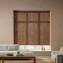Load image into Gallery viewer, A stylish installation of Genoa Mushroom Luxe natural light filtering roller shades, enhancing a modern interior space.
