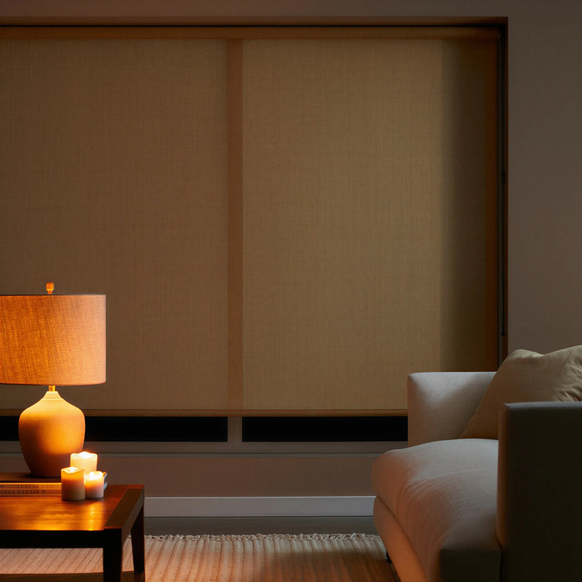 Golden brown Wheat Luxe natural light filtering shades in a living room, adding a natural touch to the windows.