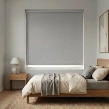 Load image into Gallery viewer, Modern Fabric Blackout Roller Shades in gray elegantly complement this calming bedroom's neutral atmosphere, filtering natural light and ensuring restful sleep.
