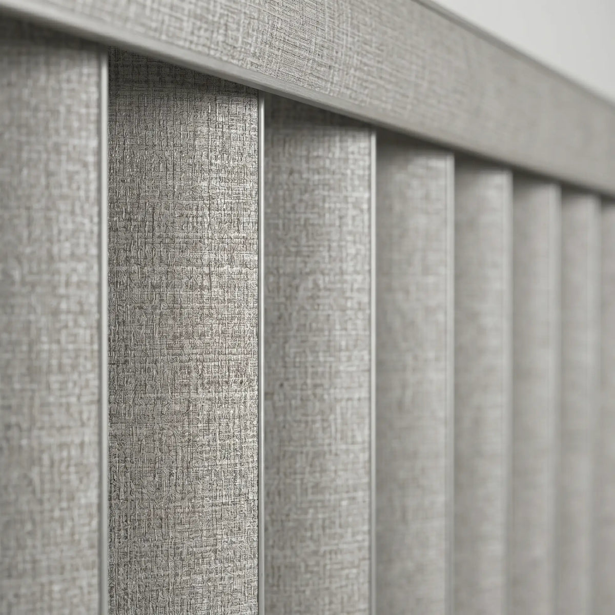 Gray Signature Pvc Vertical Blinds installed in a minimalist living space, blocking out harsh glare while maintaining a clean aesthetic.