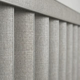 Gray Signature Pvc Vertical Blinds installed in a minimalist living space, blocking out harsh glare while maintaining a clean aesthetic.