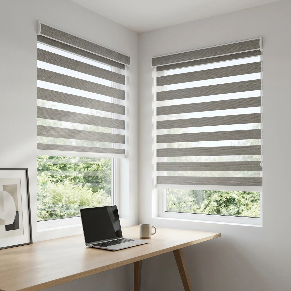 Zebra Solar Roller Shades in Gray elegantly filter natural light while providing UV protection and a comfortable atmosphere for working or relaxing.