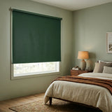 Classic Blackout Vinyl Roller Shades for a serene bedroom ambiance, featuring green accents and 0.13 thickness.