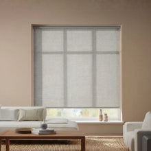Load image into Gallery viewer, A stylish installation of Greyson Dark Gray Flint Luxe natural light filtering roller shades, enhancing a modern interior space.
