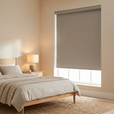 Modern Fabric Blackout Roller Shades in Light Beige complement neutral tones while blocking out light for a peaceful ambiance.