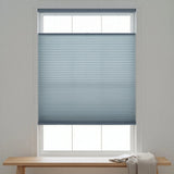 Elegant Light Blue (Hazy) 3 8 Budget Single Cell Light Filtering Top Downbottom Up Shades complementing a modern reading nook, bathing the space in soft light with dynamic window coverage.