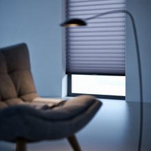 Load image into Gallery viewer, A cozy living room featuring Light Blue (6_Pewter Tdbu Editorial Crop V2   Upscaled) 9 16 Classic Single Cell Light Filtering Cordless Shades, filtering harsh rays and allowing flexible privacy management.
