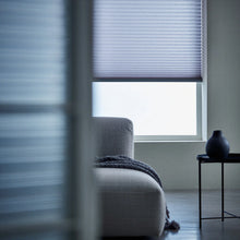 Load image into Gallery viewer, A look at Light Blue (Royal Grey) 7 16 Inch Double Cell Light Filtering Shades inside a peaceful living space, protecting furniture from fading while maintaining a bright feel.
