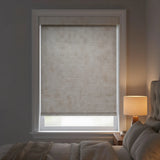 Main view of light gray Jerusalem Silver Luxe natural room darkening roller shades in a modern bedroom with neutral tones.
