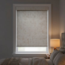 Load image into Gallery viewer, Main view of light gray Jerusalem Silver Luxe natural room darkening roller shades in a modern bedroom with neutral tones.
