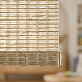 Detailed macro shot of the tan Natural Luxe woven wood-look light filtering roller shade texture, highlighting the technical decorative weave.