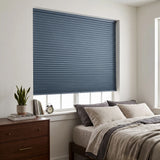 Navy Canadian-Tuxedo Signature Blackout Double Cellular Shade on a bedroom window beside a wood nightstand