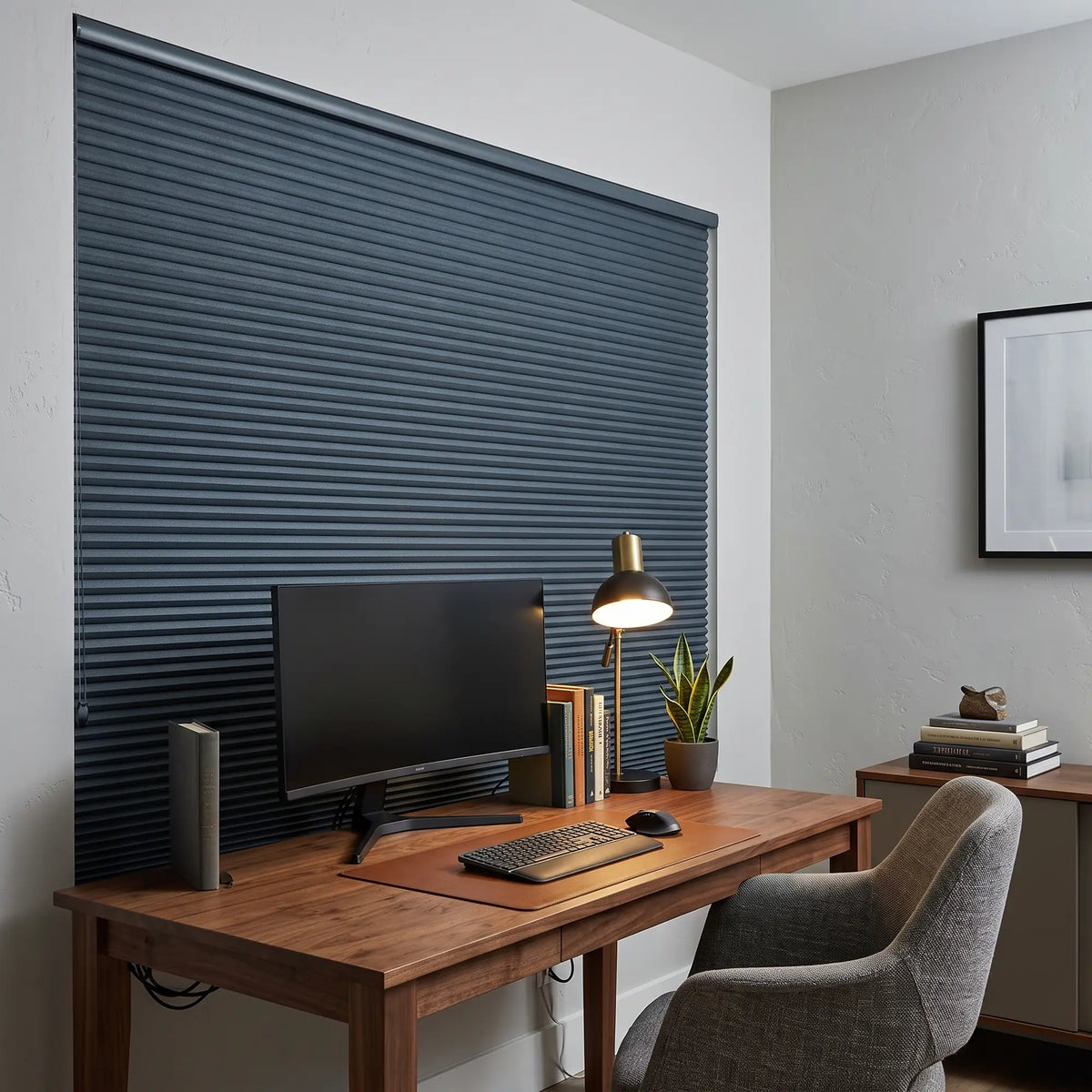 Navy Canadian Tuxedo Signature Blackout Double Cellular Shade on a home office window behind a desk and monitor