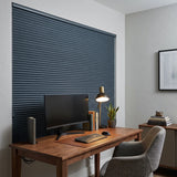 Navy Canadian Tuxedo Signature Blackout Double Cellular Shade on a home office window behind a desk and monitor