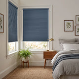 Navy Canadian Tuxedo Signature Blackout Single Cellular Shade on a bedroom window beside a mid-century nightstand