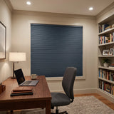 Navy Canadian Tuxedo Signature Blackout Single Cellular Shade on a home office window beside a bookshelf
