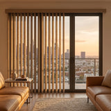View of a modern living space with Rich Brown Signature Pvc Vertical Blinds, combining practical light filtering with a structured modern look.