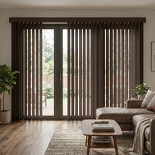 Load image into Gallery viewer, Signature Collection Fabric Vertical Blinds in Rich Brown beautifully complement a wooden deck and lush potted plants, harmonizing indoor-outdoor living spaces.
