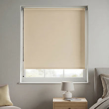 Load image into Gallery viewer, Classic Tan Sand Signature blackout shades installed in a nursery to create a perfectly dark sleeping environment.
