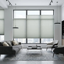 Load image into Gallery viewer, A modern living room featuring Single 9 16 Classic Single Cell Light Filtering Cordless Top Downbottom Up Cordless Shades, gently diffusing sunlight with flexible top-down/bottom-up control.
