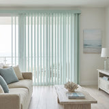 Interior view of a warm living space styled with Sky Blue Signature Pvc Vertical Blinds, perfect for covering sliding glass doors or large windows.