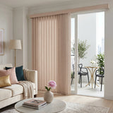 Styling a warm living room with Soft Pink Premier Pvc Vertical Blinds, ideal for expansive windows requiring versatile light management.