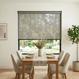 Enhance your dining area with Premier 5% Solar Screen Roller Shade, providing a calming atmosphere and UV protection while filtering in soft gray sunlight.
