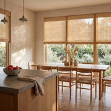 Almond Natural Bamboo Shades in warm tan on kitchen dining windows with morning light