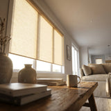 Classic Fabric Light Filtering Roller Shades in warm tan filter soft natural light for a relaxing atmosphere, perfect for reading or unwinding.