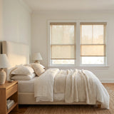 Contemporary Fabric Light Filtering Roller Shades in warm tan complement white decor, allowing soft natural light and UV protection