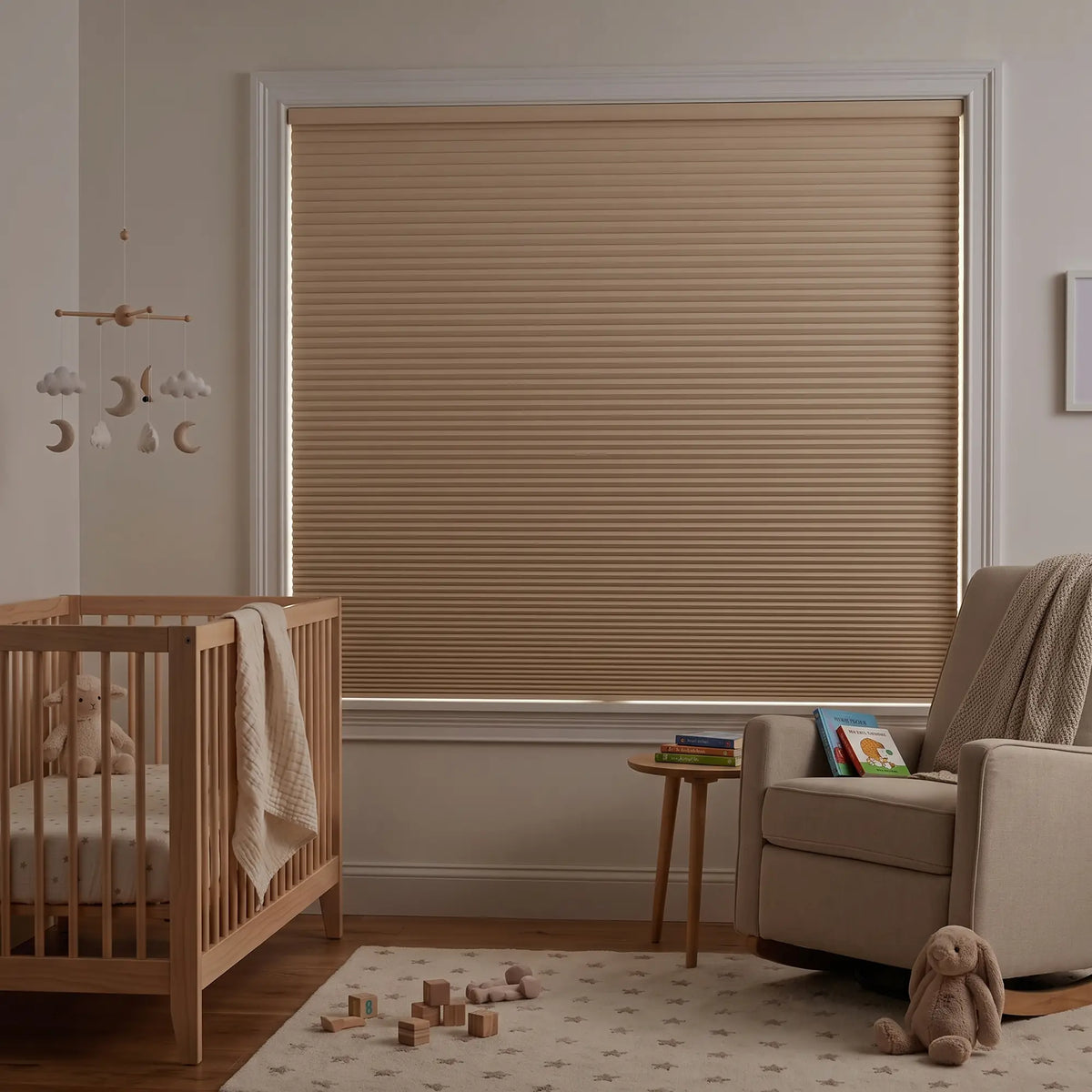 Tan Gingerroot Signature Blackout Double Cellular Shade on a bedroom window beside a wood nightstand