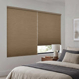 Tan Gingerroot Signature Blackout Single Cellular Shade on a bedroom window beside a mid-century nightstand