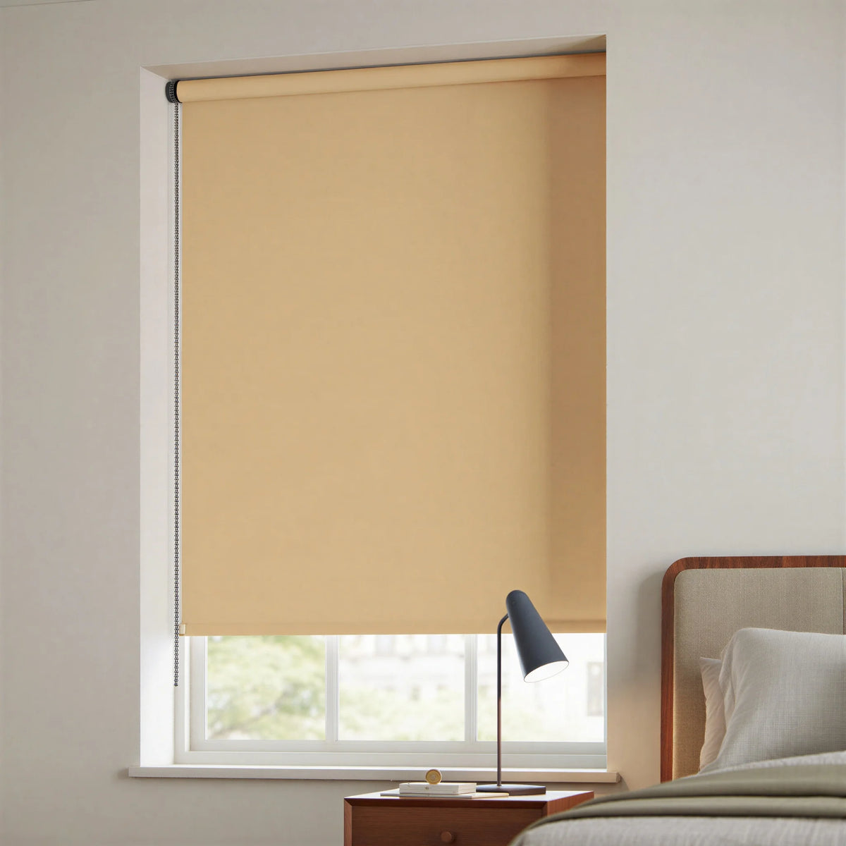 Tan Navajo-colored signature blackout roller shades installed in a contemporary bedroom for sleep optimization.
