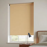 Tan Navajo-colored signature blackout roller shades installed in a contemporary bedroom for sleep optimization.