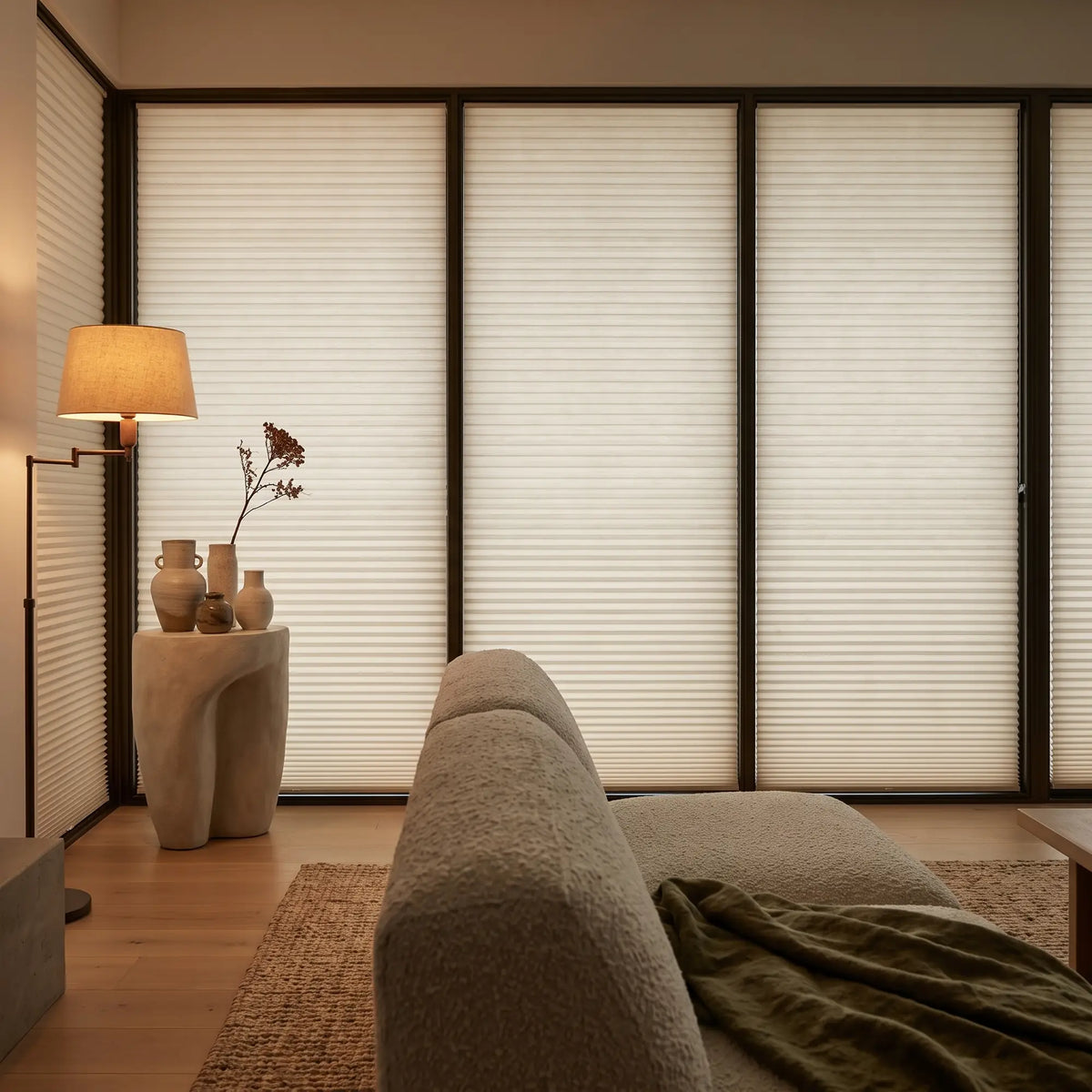 Tan Signature Blackout Single Cellular Shade on a sliding door in a spa-inspired living room