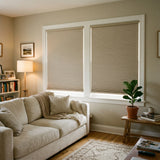 A cozy living space featuring Tan 1 2 Inch Budget Single Cell Blackout Cordless Shades, eliminating unwanted sunlight for optimal sleep.