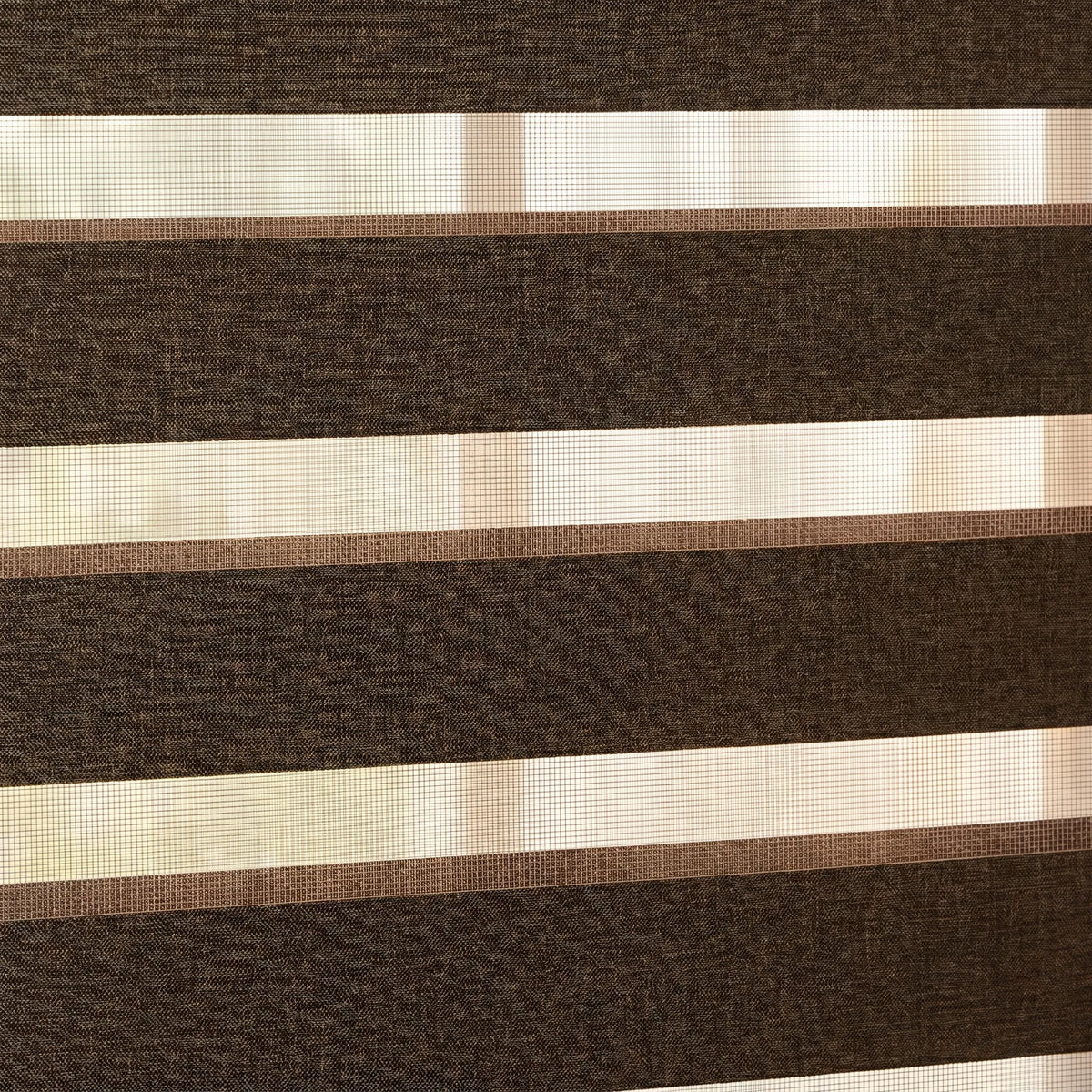 Elevate your space with Zebra Light Filtering Roller Shades' earthy tone, perfect for warm and inviting interior designs.